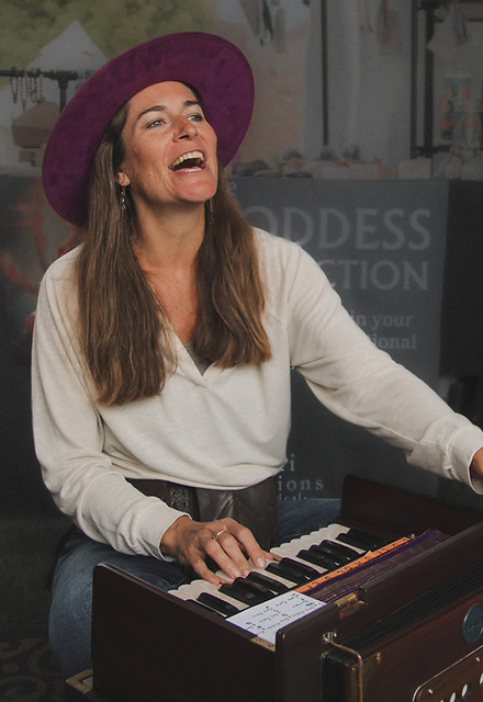 Mindy Arbuckle performing devotional song with harmonium