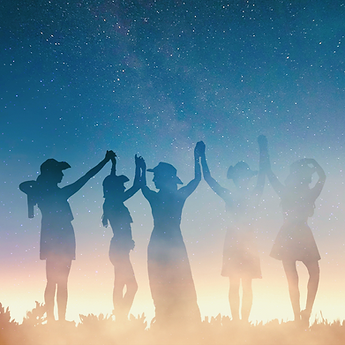 Group of women in the dark celebrating sacred feminine empowerment and awakening