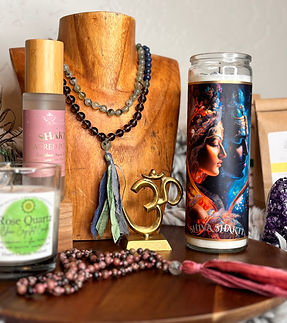 Shakti Shiva altar with candles and mala necklaces. Crystal mala beads, candle, aura spray, and sacred altar tools created by Mindy Arbuckle