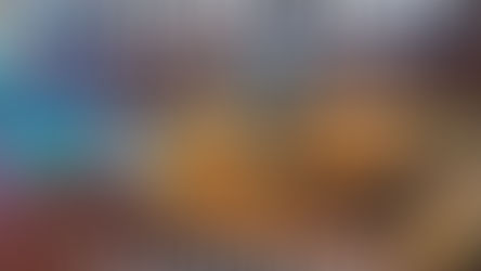 Warm Ayurvedic root veggie and greens bowl with quinoa, roasted vegetables, leafy greens, avocado, and lemon tahini drizzle, served alongside a cup of herbal tea for grounding winter nourishment