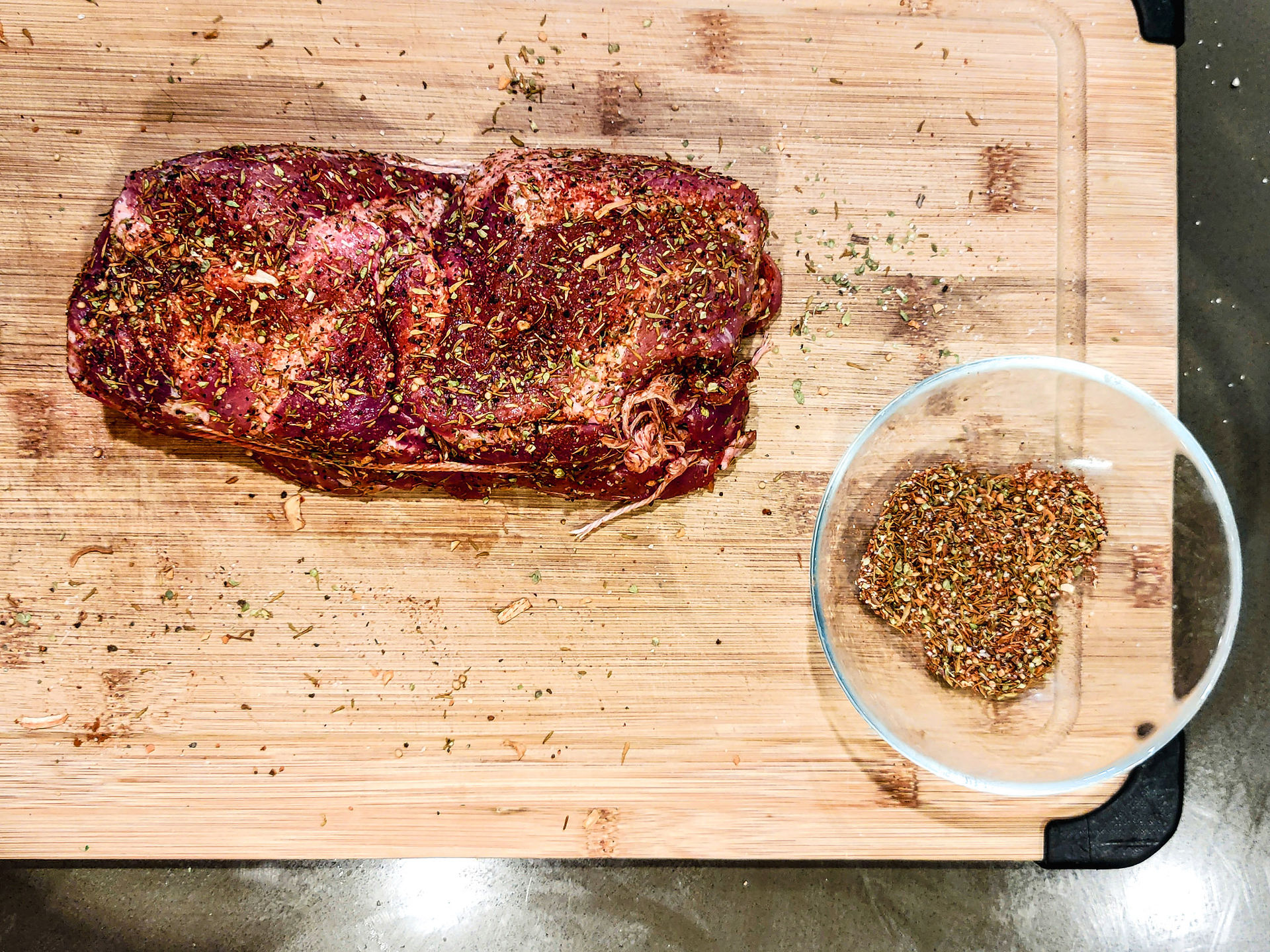 spiced up pork butt on cutting board