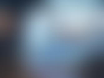 Hand using pen on digital dashboard with charts and graphs. Blue and red bars, pie chart, futuristic glowing interface. Business setting.