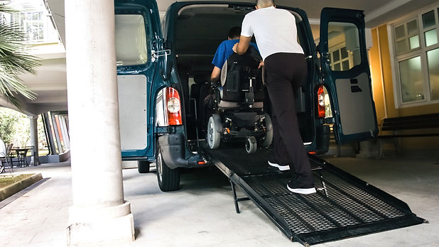 Man on wheelchair using accessible vehic