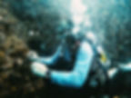 scuba diver underwater with dive watch on wrist