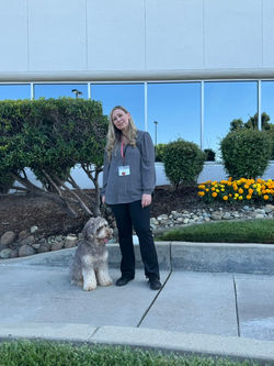 Trainer and Australian Labradoodle therapy dog