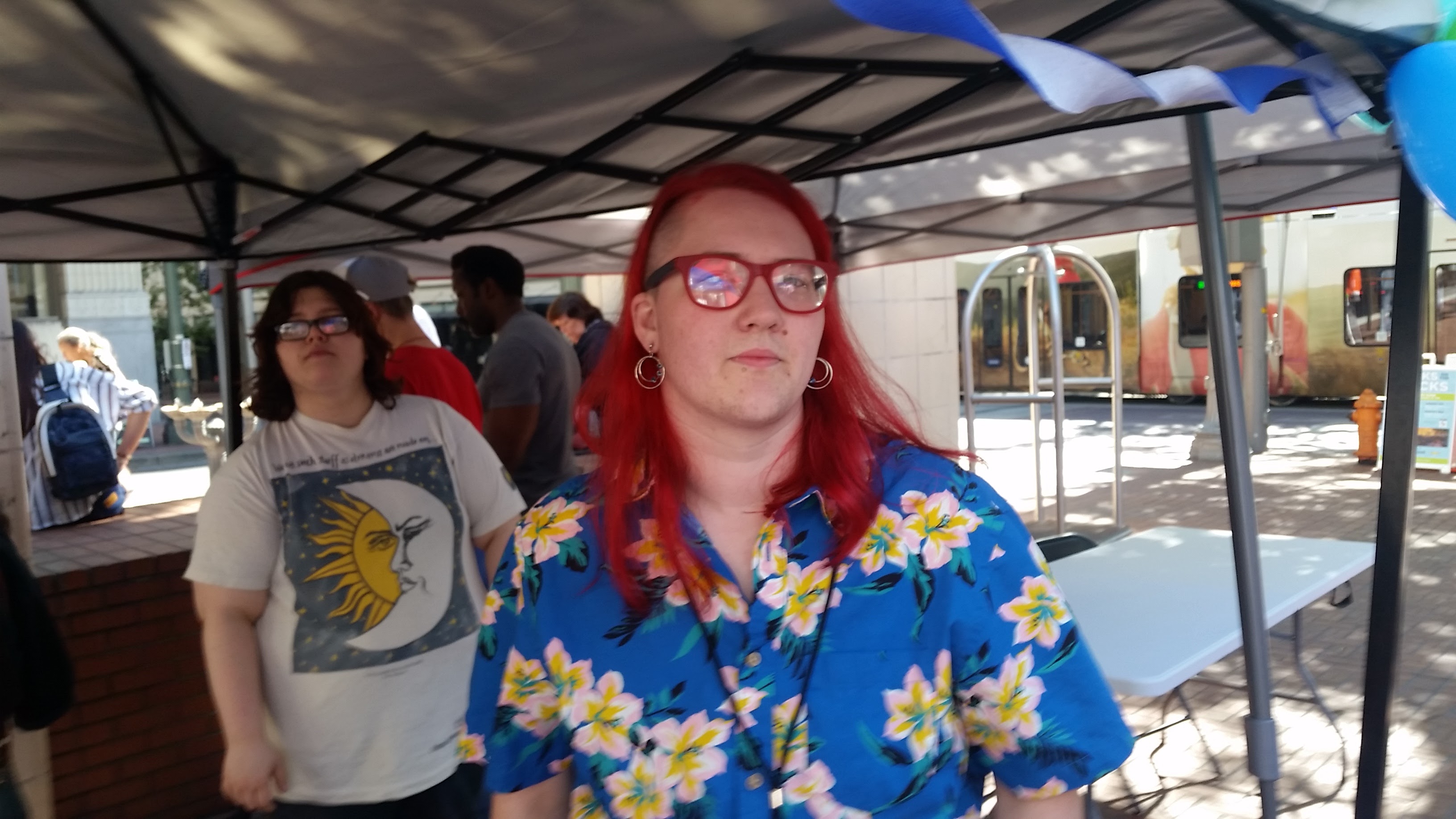 Red haired young man in blue floral