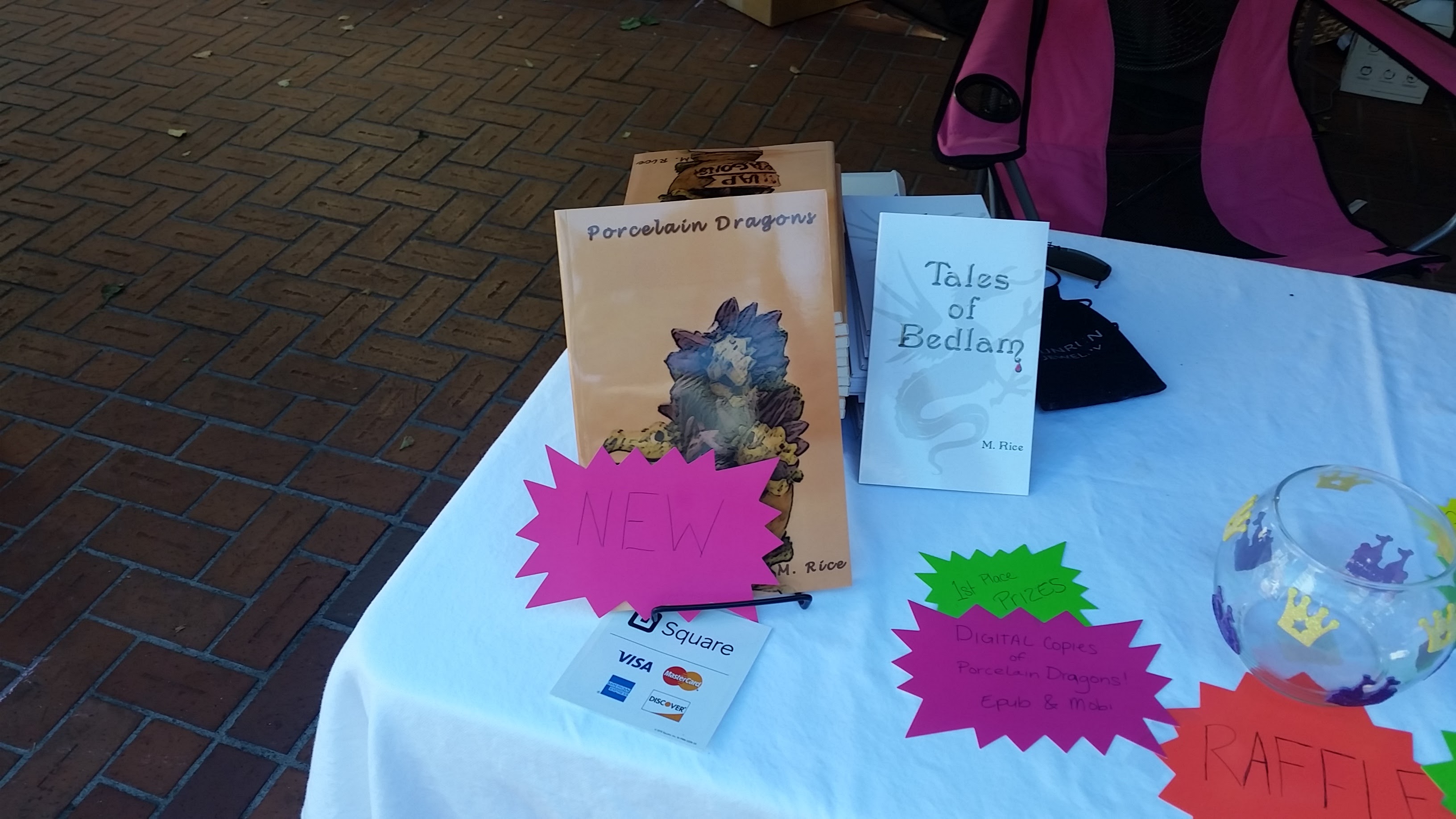 Book cover with pink splash in front