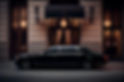 luxury-car-speeds-by-modern-building-dusk-generative-ai.jpg