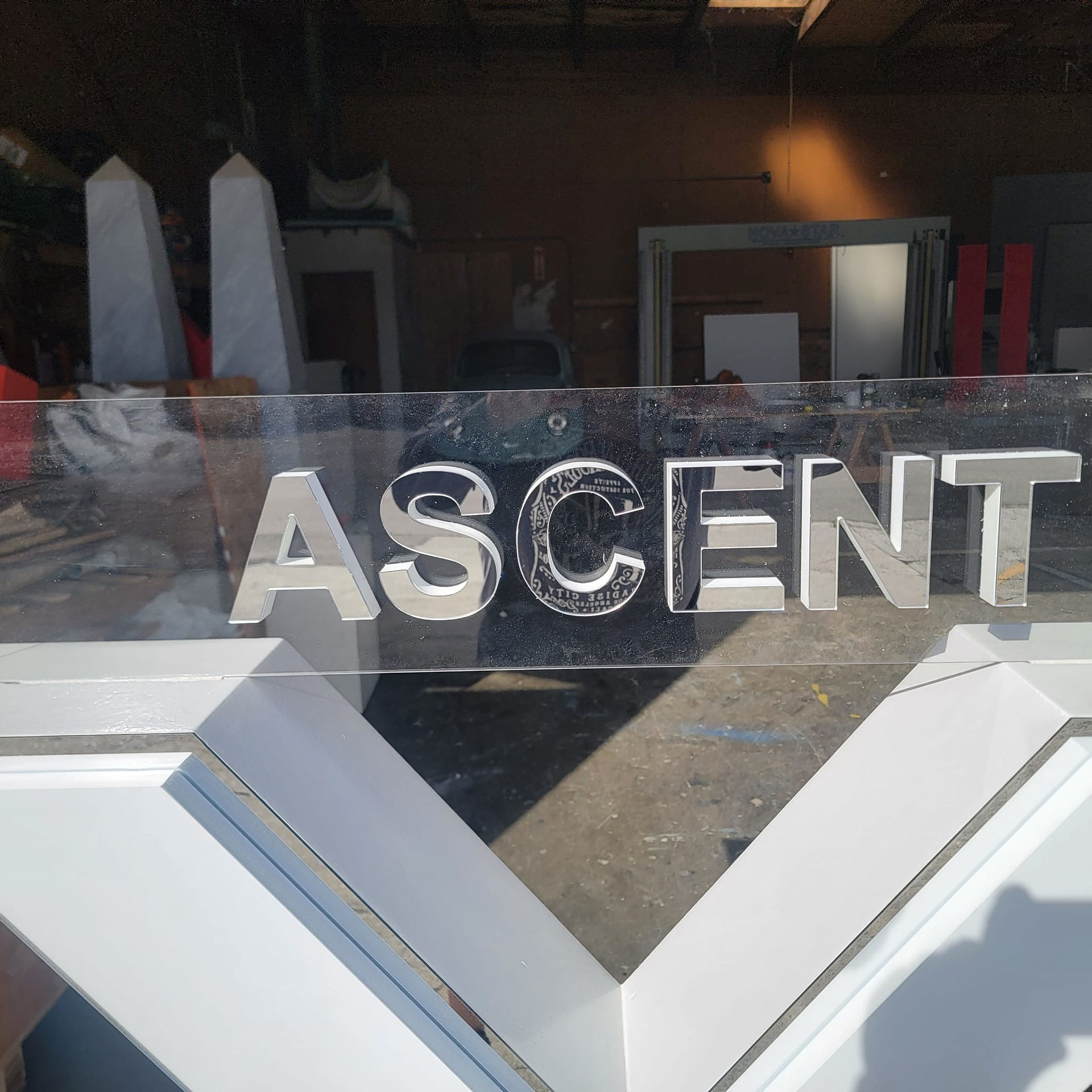 mirror vinyl over acrylic logo sign display fabricated by WeCutFoam for Carribean Cruise