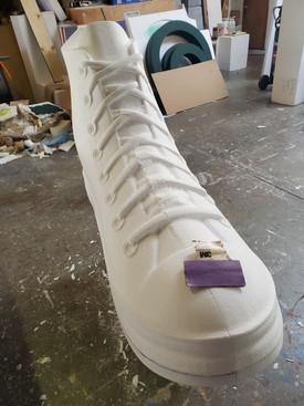 sanded machined large shoe foam prop at 5ft long for a charity drive