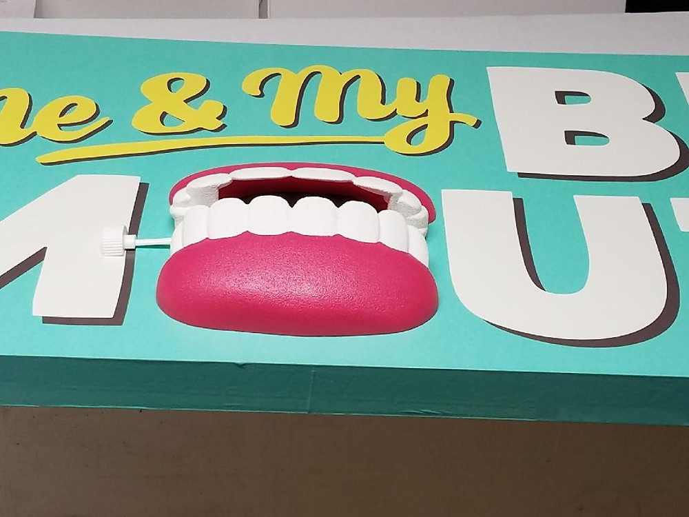 Adhesive vinyl foam sign with 3D foam prop