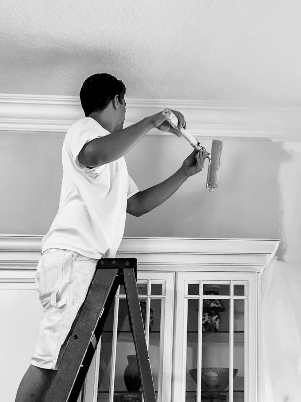 Man Painting Wall