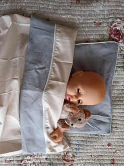 Custom sheet set in blue linen and white piping