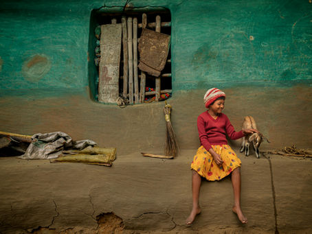 A girl outside the house after cleaning