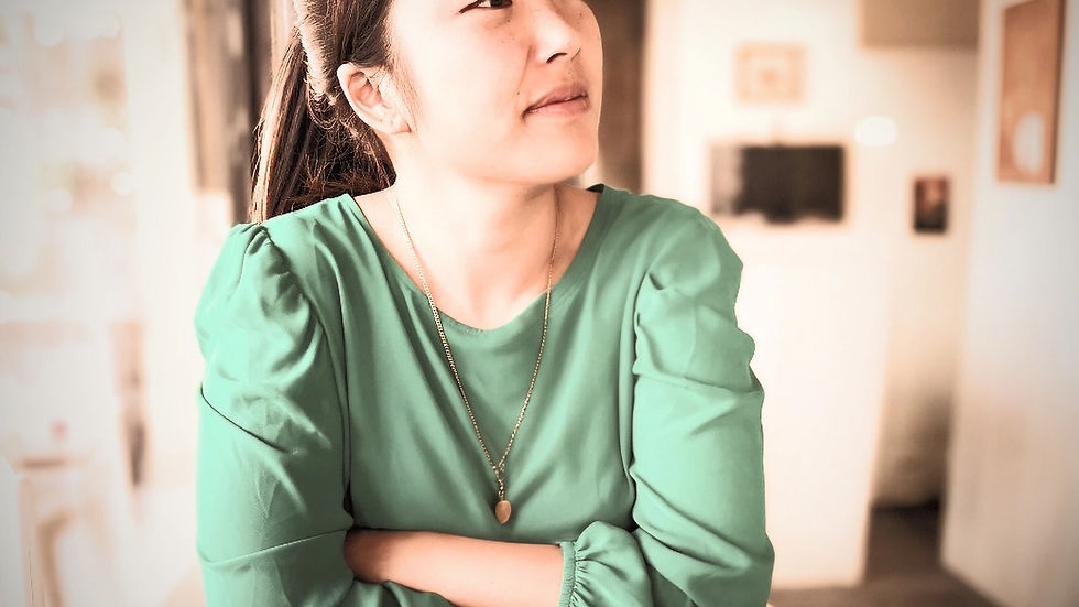 Asian woman in professional setting building confidence and finding her voice at work