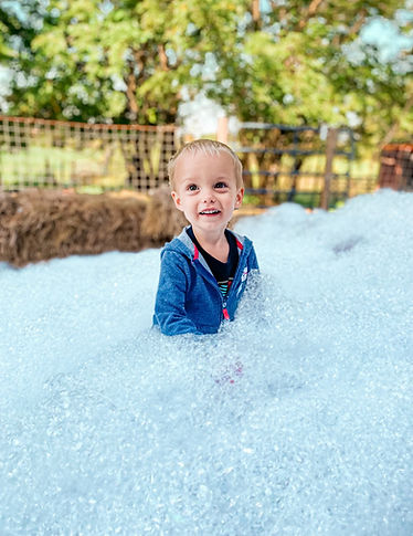 Child playing in bubbles