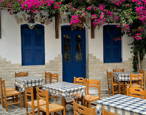 Antiparos: A peaceful Cycladic harbor with fishing boats for Antiparos Golden Visa content.