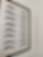 Eyebrow threading styles displayed on a practice training board.