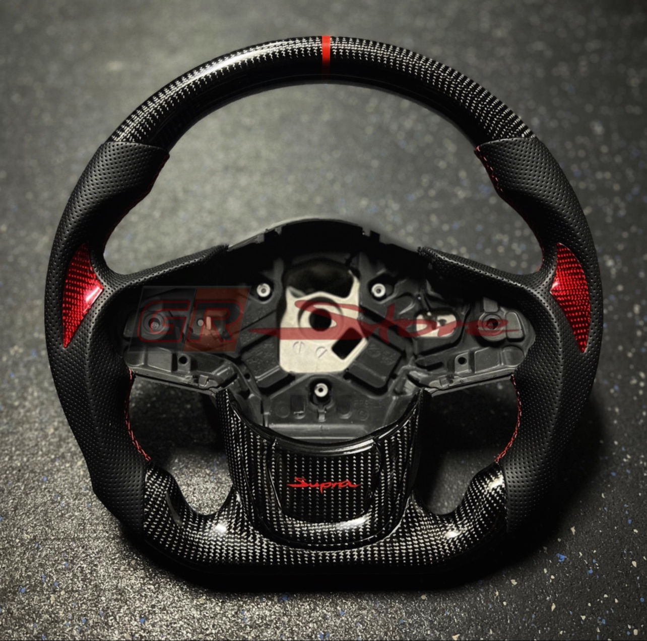 Custom A90 Steering Wheel- Perforated Leather, Red Stripe and Red CF Thumbs