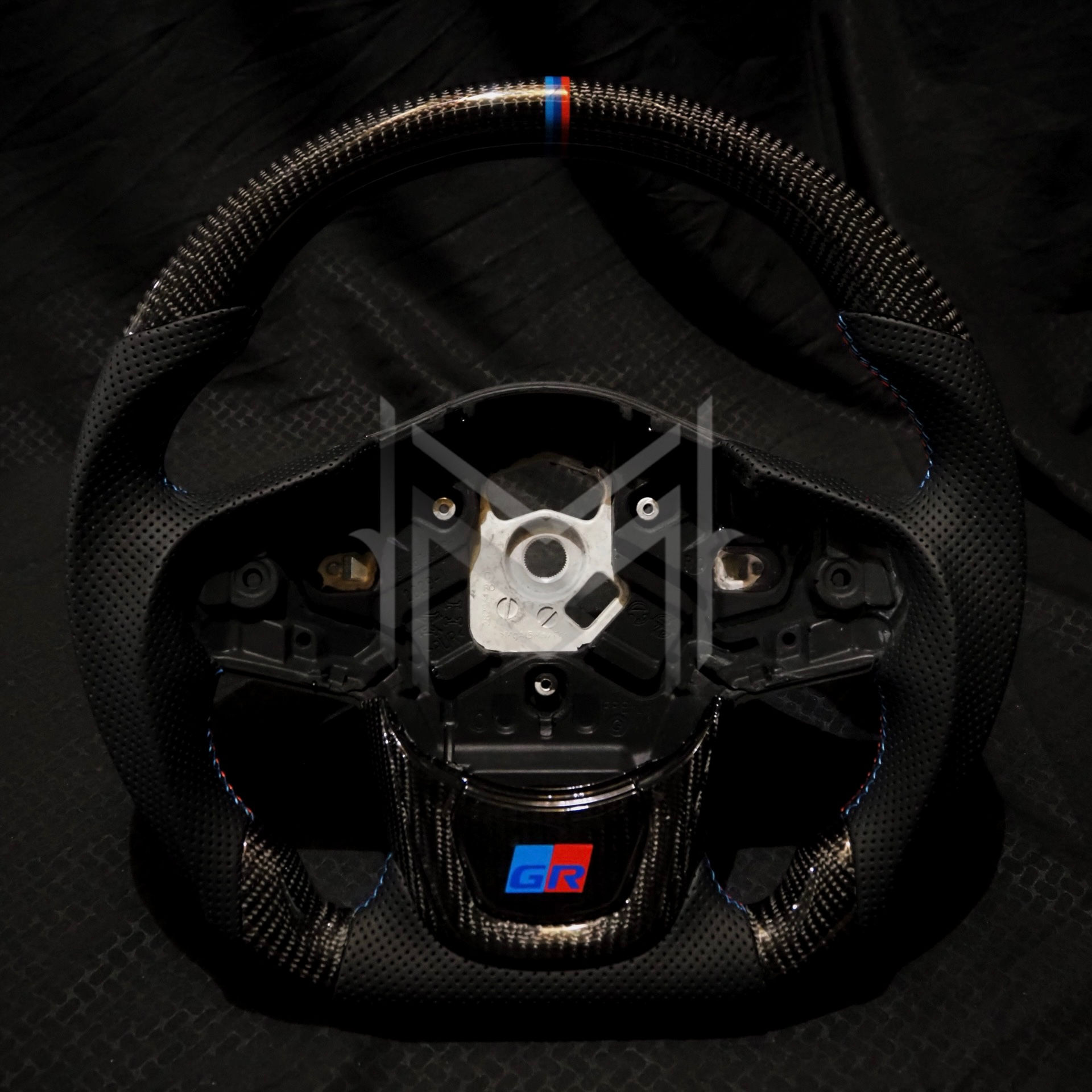 A90 Supra Carbon Fiber Steering Wheel- Tri-Perforated Leather, BMW Colors