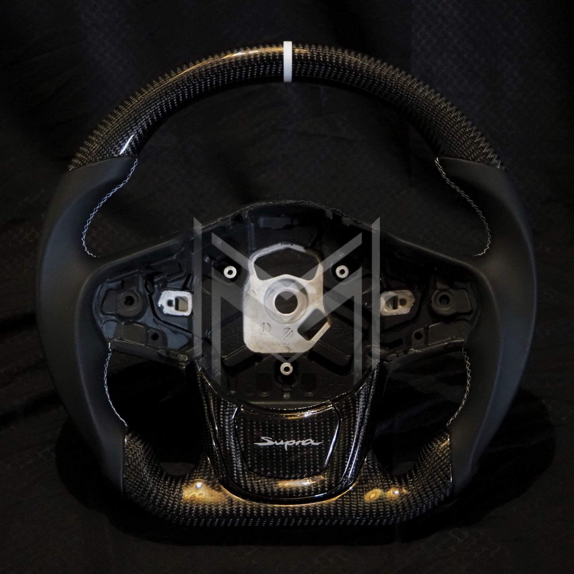 A90 Supra Carbon Fiber Steering Wheel- Smooth Leather with White Accents