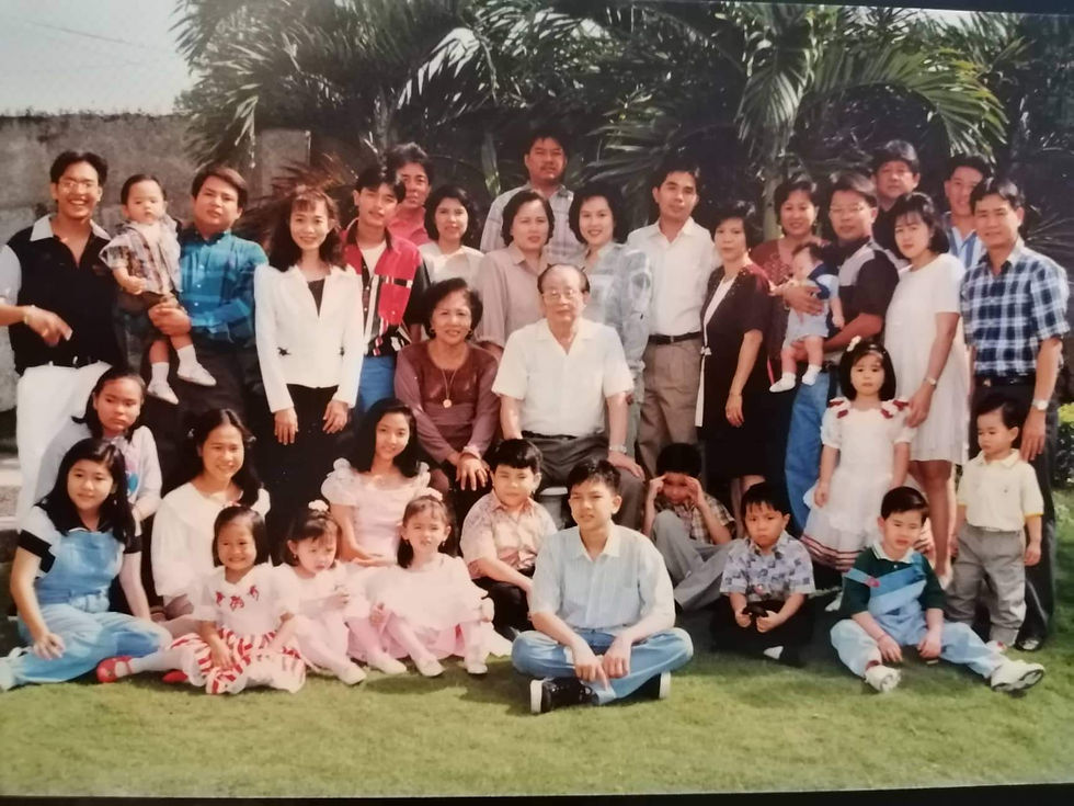 Amah (seated at the center) surrounded by her many children and grandchildren in the late 1990s