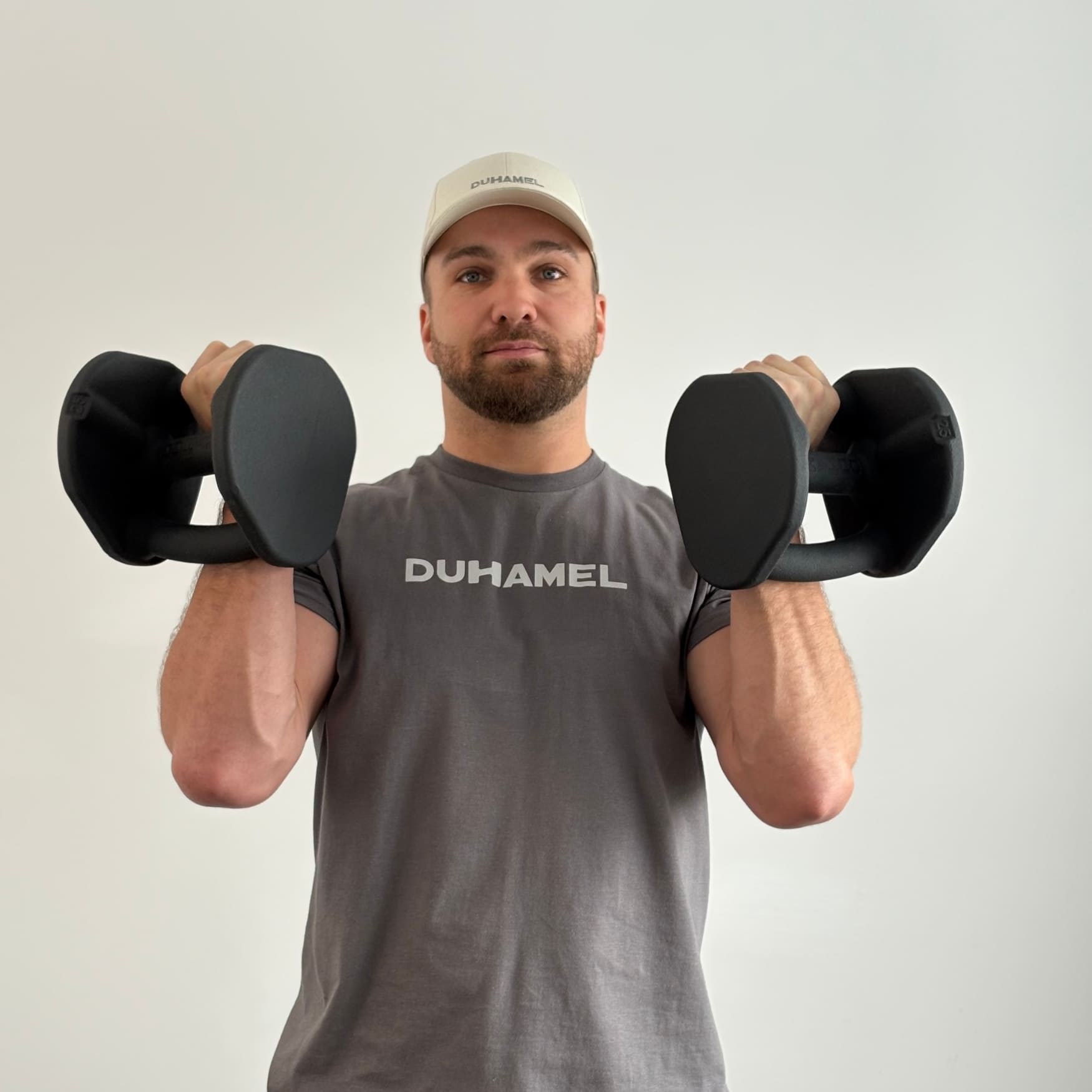 Homme faisant des Kettlebell Clean avec Haltères Duhamel