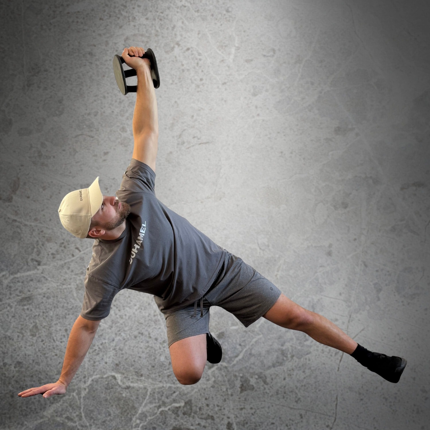 Homme faisant des Turkish Get-Up avec Haltères Duhamel