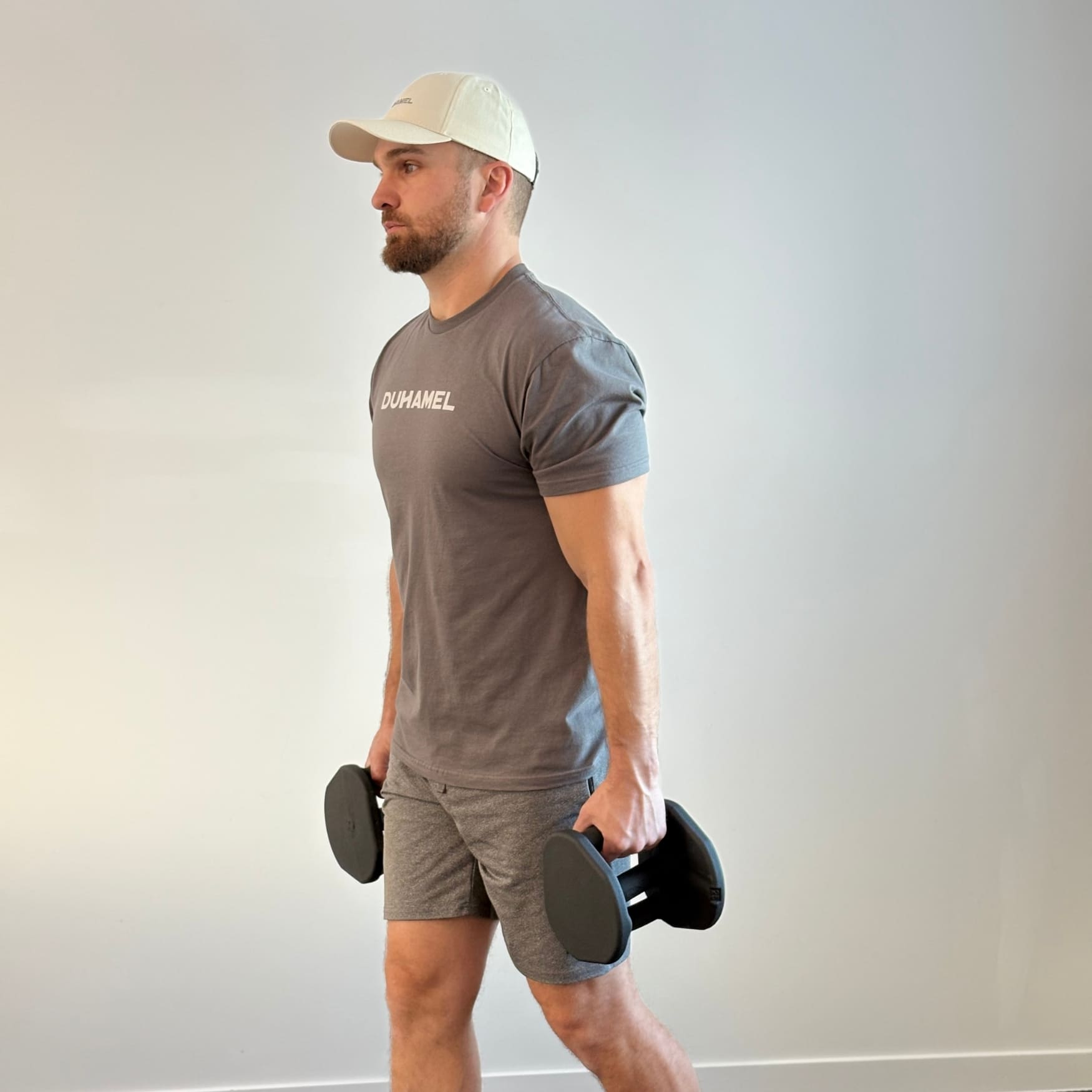 Homme faisant des Kettlebell Spartan Side Plank avec Haltères Duhamel