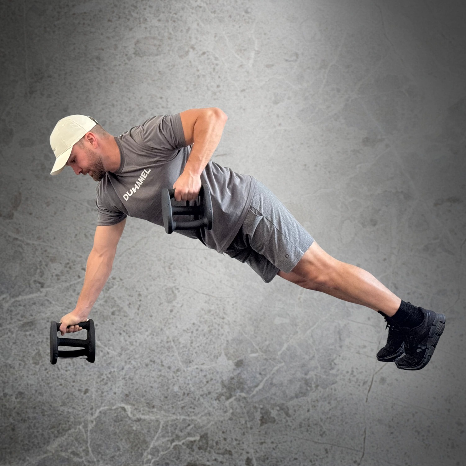 Homme faisant des Renegade Row avec Haltères Duhamel