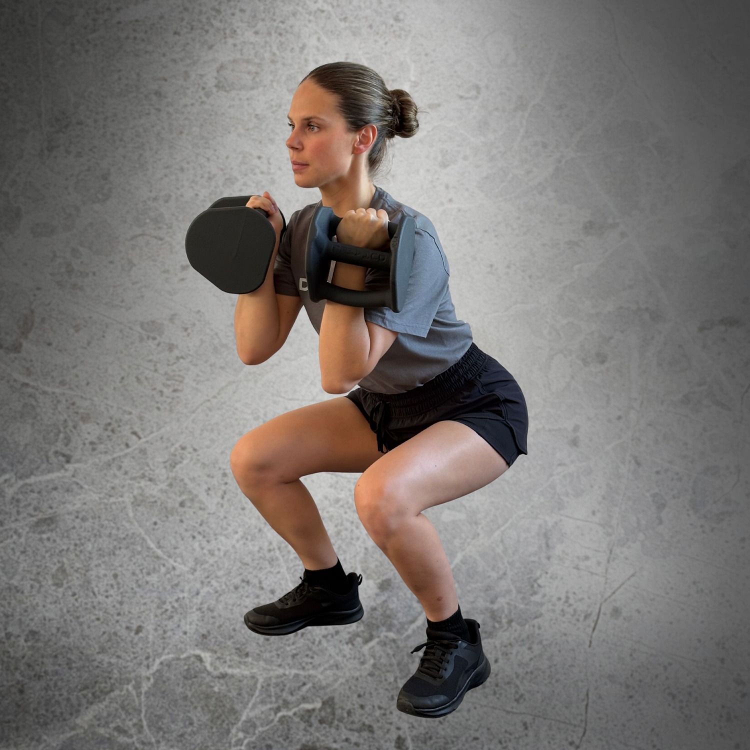 Femme faisant des Clean and Squat avec Haltères Duhamel