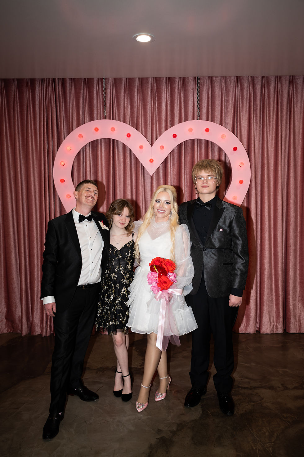 family photo of bridge and groom inside sure thing chapel Las Vegas las Vegas elopement photographer.
vegas wedding photographer.