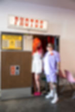 two brides, bride and bride wedding, Las Vegas elopement, Las Vegas elopement photographer, downtown vegas elopement, Las Vegas wedding, uk brides, uk bride, lgbtq+, vegas, wedding, destination wedding, sure thing chapel, vegas chapel, vegas photographer, holding neon sign, photo booth