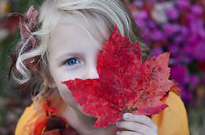 Girl with Autumn Leaf