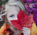 Girl with Autumn Leaf