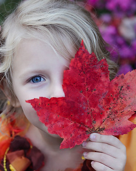 Girl with Autumn Leaf