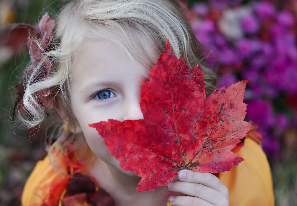 Girl with Autumn Leaf