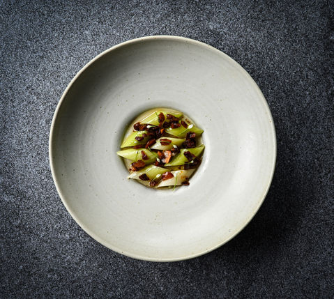 BBQ Leek with black garlic and hazelnuts at L’Arôme by the Sea, a French fine dining restaurant in Phuket