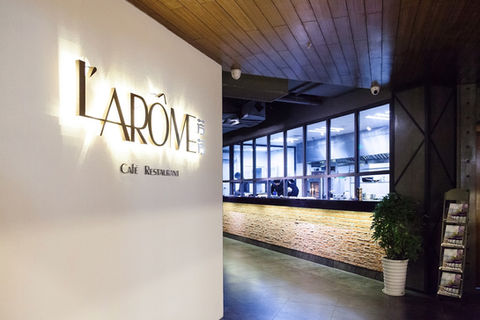 Elegant L’Arôme restaurant dining room inside Jinling Hotel, Nanjing, with refined French ambiance.