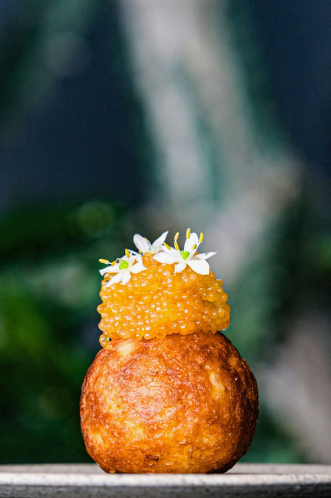 Artistic plating of pike roe beignet at L’Arôme by the Sea French fine dining restaurant