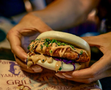 Chicken katsu bao with golden-fried cutlet and fresh toppings in a fluffy bun at Bon Pan Asian Tapas Phuket Town