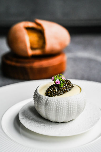 Osciétre caviar potato with Mori-Tama egg served at L’Arôme by the Sea, luxury French fine dining restaurant in Phuket with oceanfront views.