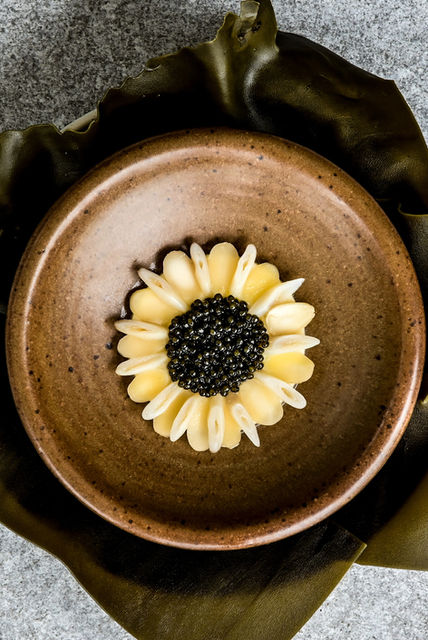 Razor clam topped with caviar and creamy parmesan custard at L'Arome by the sea