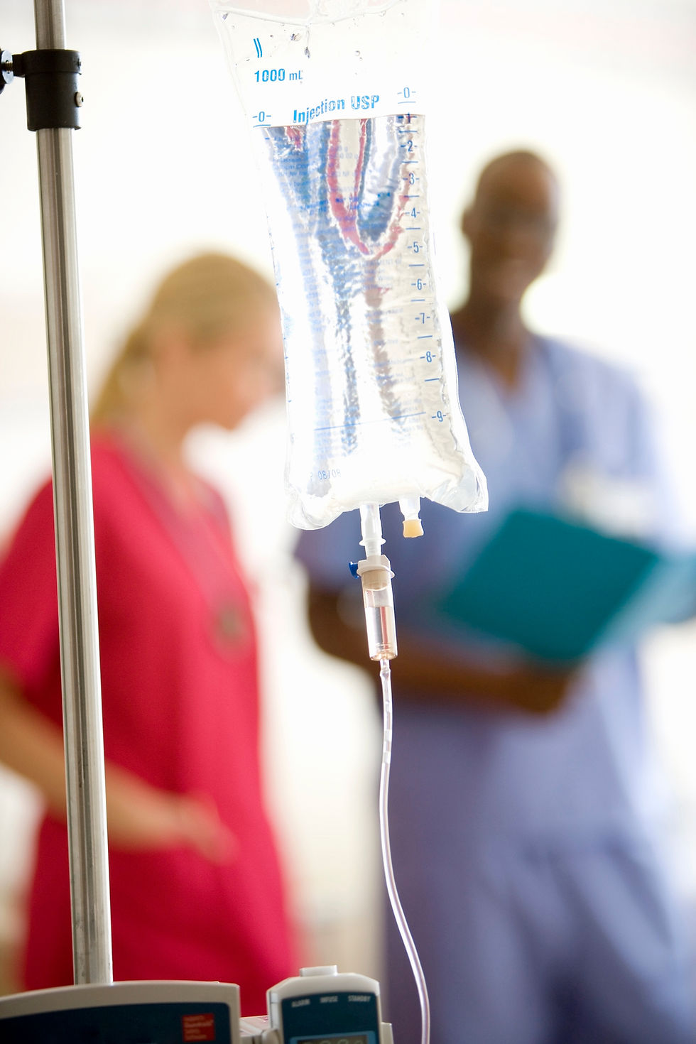 iv-drip-with-hospital-staff-in-the-background-2026-03-26-08-37-08-utc.jpg