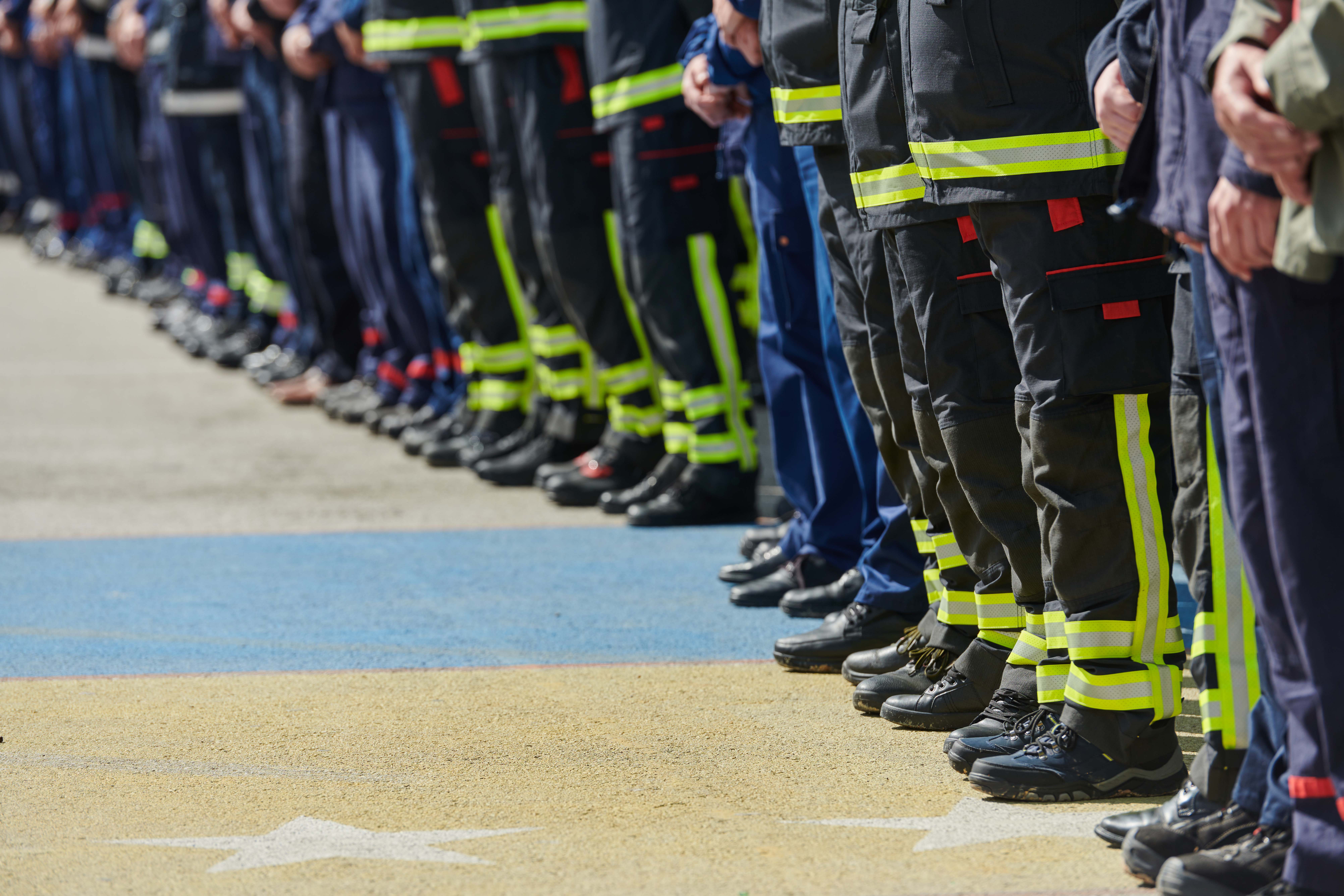 a-group-of-firefighters-lined-up-saluting-the-fla-2025-01-15-16-10-28-utc.jpg