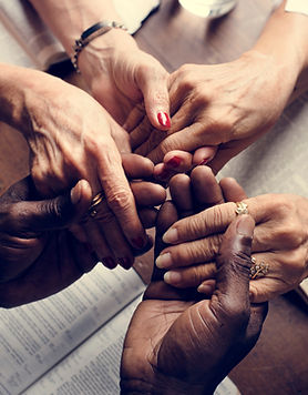 3 sets of hands held Praying Together representing Allowing Yourself to be supported in grief