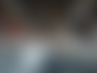 Urban Bridge Weigh-In-Motion via Vision-Strain Fusion