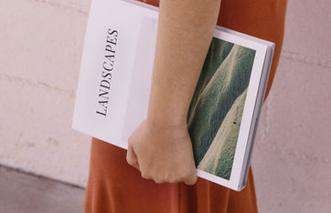 Woman carrying a book in her arm