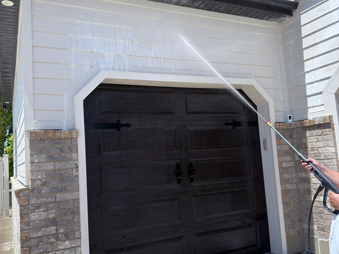 Pressure washing a home exterior
