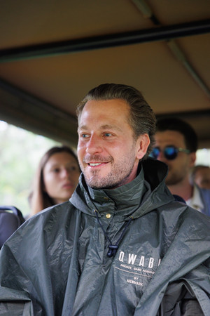 man sitting on a safari vehicle